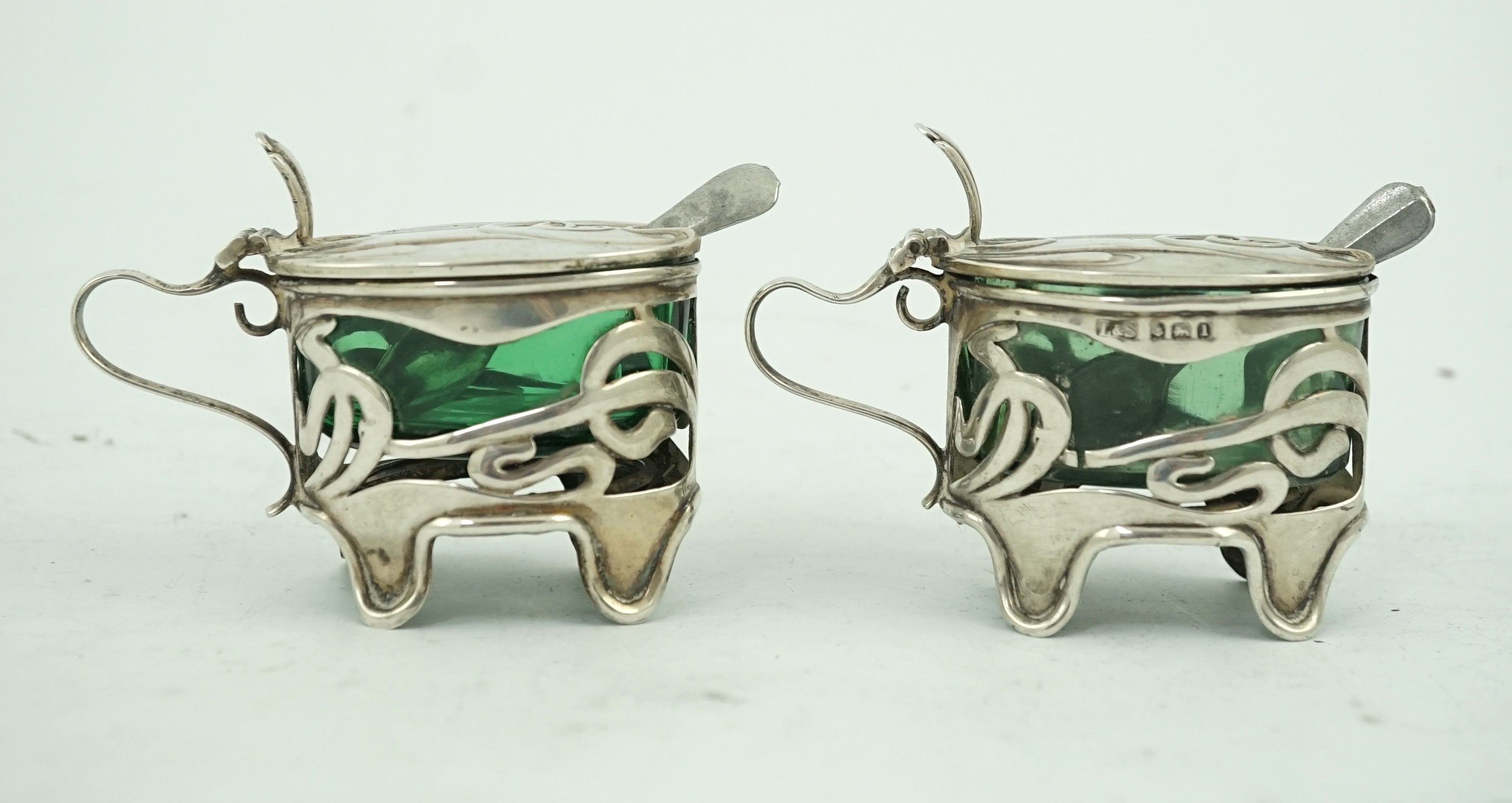 An early 20th century Art Nouveau pierced silver ten piece condiment set by Levy & Salaman